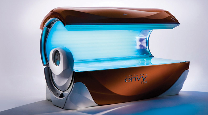 A tanning bed with blue lights on it.