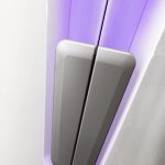 A close up of the side of a purple and white refrigerator.