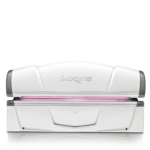 A white and pink vacuum machine sitting on top of a table.