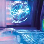 VEGAZ5 A close up of a glass table with a laptop